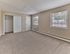 Spacious bedroom with large closet, natural light, and wall-to-wall carpet at Maple Terrace Apartments in Maple Shade, NJ
