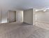 Open living and dining area with carpet and vinyl flooring at Maple Terrace Apartments in Maple Shade, NJ