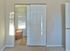 Spacious bedroom closet with sliding doors and built-in shelving at Haynes Run Apartments in Medford, NJ