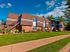Exterior of building 1200 at Haynes Run Apartments in Medford, NJ featuring well-maintained landscaping and a sunny suburban setting