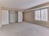 Spacious primary bedroom with large window and double closets in a 2 bedroom, 2 bathroom apartment at North Crossing in Willow Grove, PA.