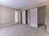 Primary bedroom with plush carpeting and large double closets in a 2 bedroom, 2 bathroom apartment at North Crossing in Willow Grove, PA.