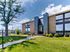 North Crossing Apartments renovated exterior with brick buildings, large windows, and mature trees in Willow Grove, Pennsylvania