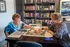Residents Finishing Puzzle in Clubhouse | Attivo Trails Waukee | Waukee, Iowa