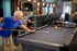 Residents Playing Billiards in Clubhouse | Attivo Trails Waukee | Waukee, Iowa