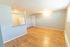 spacious room with wood floor