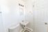 inside full bathroom facing sink with vanity lights