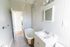 view from inside full bathroom with tub