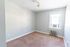 carpeted bedroom with window and ceiling light