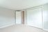 carpeted bedroom with closet