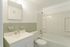 full bathroom with tiled wall and large shower