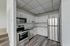 renovated kitchen with appliances at franklin manor