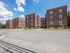 folcroft courts view from street, tall brick buildings, sidewalks and grassy areas