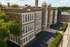 Franklin Manor Apartments, historic brick three-story building with tall multi-pane windows and parking lot in West Reading PA.