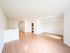 Bright, open-concept living area with sleek wooden flooring and contemporary finishes, ideal for modern living.
