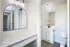 Fully Renovated Bathroom w/ Vanity and contemporary lighting.