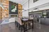 A 24/7 clubhouse with comfortable seating areas, a fireplace, Crimson Cup coffee bar, and large windows offering views of the surrounding landscape.
