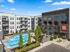 Aerial view of The Ave, apartments for rent in Clintonville, Ohio, overlooking the swimming pool and leasing office.