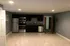 Modern kitchen with stainless steel appliances, sleek cabinetry, and a spacious open layout.