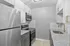 Contemporary kitchen with stainless steel appliances, granite countertops, and elegant cabinetry.