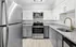 Sleek kitchen with stainless steel appliances, granite countertops, and modern cabinetry.