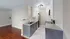 Stylish kitchen featuring sleek gray cabinets, granite countertops, and modern stainless steel appliances.