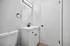 Sleek modern bathroom with stylish fixtures, featuring a chic white vanity and elegant black hardware. Oakley Square Apartments Cincinnati, 2-Bedroom Apartments in Oakley Cincinnati, Pet-Friendly Apartments in Oakley, Renovated Apartments near Hyde Park, Sunset Cincy Oakley Square Apartments, Apartments in Oakley Cincinnati, Apartments near Rookwood Commons, Apartments near Hyde Park Cincinnati.