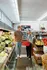 apartments in Clintonville near Weiland's Market. Weiland's Market in Clintonville,Smiling couple shopping for fresh produce at a vibrant, well-stocked grocery store.