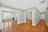 Elegant apartment interior featuring hardwood floors, a cozy living room with a fireplace, and a dining area with stylish lighting.