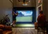 Modern apartment feature with virtual golf setup, highlighting a relaxed and engaging entertainment space.
