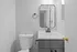 Chic modern bathroom with elegant fixtures, a sleek vanity, and sophisticated black accents.