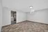 Bright and spacious basement room with modern flooring and natural light, offering potential for a cozy living area or home office.