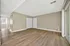 Spacious and bright living area with elegant wood flooring and modern finishes, perfect for relaxing and entertaining.