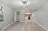 Bright open-plan apartment featuring modern kitchen, ample closet space, and sleek air conditioning in a spacious living area.
