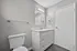 Sleek modern bathroom with elegant vanity, polished fixtures, and contemporary lighting design.