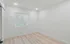 Bright and inviting empty room with elegant hardwood flooring and natural light filtering through stylish blinds.