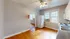 Bright kitchen with wooden floors, white cabinets, and modern appliances.