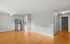 Bright open-concept living area with hardwood floors and a modern kitchen.