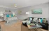 Inviting bedroom featuring a cozy bed, stylish couch, and contemporary decor.