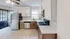 Modern kitchen with sleek stainless steel appliances, stylish hexagonal backsplash, and elegant cabinetry, inviting natural light.