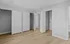 Spacious bedroom with sleek white closet doors, elegant gray walls, and stylish wood flooring, Alcove of Turpin Hills Apartments in Cincinnati.