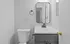 Sleek and modern bathroom featuring a stylish vanity with a large mirror, elegant faucet, and contemporary lighting.