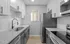 Chic modern kitchen with sleek granite countertops, stylish cabinetry, and stainless steel appliances.
