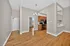 Bright modern apartment with open layout, hardwood floors, and contemporary kitchen design.