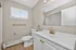 Elegant bathroom design featuring modern fixtures, sleek vanity with gold accents, and large mirror, offering a bright and welcoming space.
