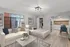 Chic studio apartment showcasing a cozy bed, stylish sofa, elegant lighting, and a modern kitchenette with dining area.