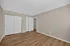 Bright and airy room featuring elegant wood flooring and neutral walls, offering versatile space perfect for personalization.