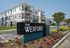 Modern Wexford apartments with stylish balconies, vibrant landscaping, and welcoming entrance signage.