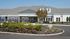 Inviting leasing center exterior with modern architecture and lush landscaped gardens.