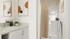 bathroom with standing shower, sink and cabinets space